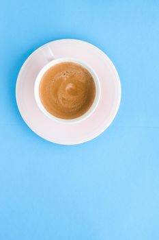 Breakfast, drinks and modern lifestyle concept - Hot aromatic coffee on blue background, flatlay