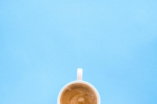 Breakfast, drinks and modern lifestyle concept - Hot aromatic coffee on blue background, flatlay