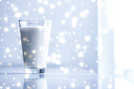 Dairy products, healthy diet and Christmas food concept - Magic holiday drink, pouring organic lactose free milk into glass on marble table