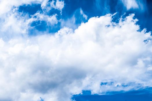 Nature backdrop, solar energy and spiritual concept - Blue sky background, white clouds and bright sunlight