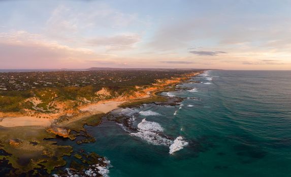 An aerial shot of Mornington Peninsula towards Point Nepean and Port Phillip Bay at sunset in Victoria, Australia