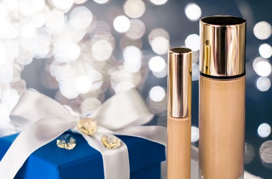 Cosmetic branding, Christmas glitter and girly blog concept - Holiday make-up foundation base, concealer and blue gift box, luxury cosmetics present and blank label products for beauty brand design