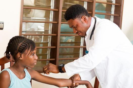 doctor makes an injection to a patient in his office at the hospital