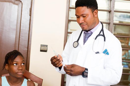 doctor prepares an injection for a patient in office at the hospital