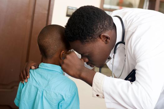 doctor examines his ear with his work tool in his clinic.