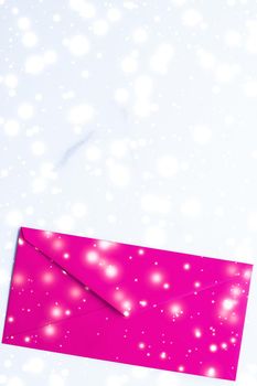 Greetings, postal service and online newsletter concept - Winter holiday blank paper envelopes on marble with shiny snow flatlay background, love letter or Christmas mail card design