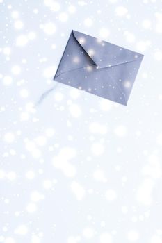 Greetings, postal service and online newsletter concept - Winter holiday blank paper envelopes on marble with shiny snow flatlay background, love letter or Christmas mail card design