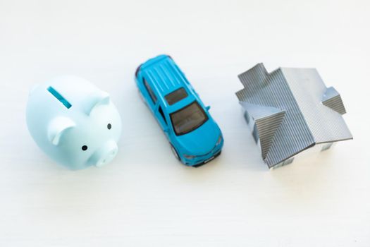 Piggy bank financial savings for house and car. Buying and renting real estate and transport concept