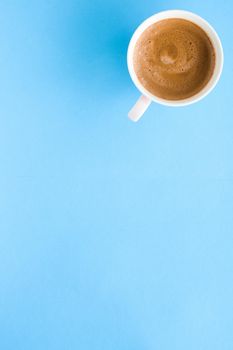 Breakfast, drinks and modern lifestyle concept - Hot aromatic coffee on blue background, flatlay