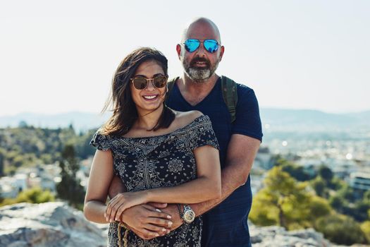 Go see the beauty out there. a couple posing against a beautiful background