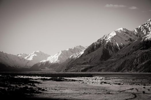 The Highway 80 road towards Mt Cook Village along Lake Pukaki on a clear spring day in Canterbury, New Zealand