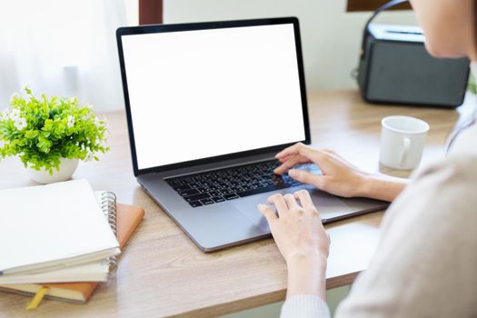 woman working on a white screen computer.