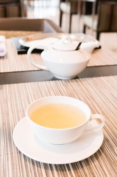 Healthy nutrition, relax and detox concept - Green herbal tea in a restaurant, five o'clock