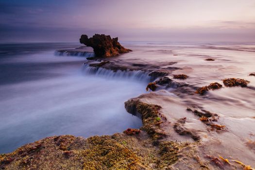 The iconic Dragon Head Rock at sunset on the Number Sixteen Beach in Rye, Victoria, Australia