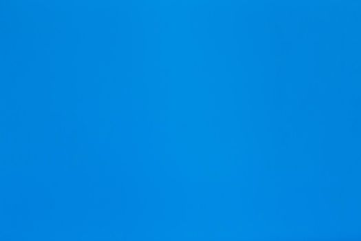Solid blue paper background with light texture.