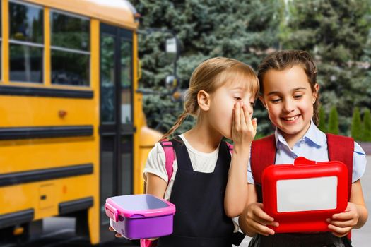 School kids eating healthy food together. schoolchildren with lunch boxes.