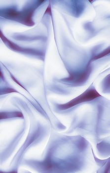 Elegant fabric texture, abstract backdrop and modern pastel colours concept - Purple soft silk waves, flatlay background