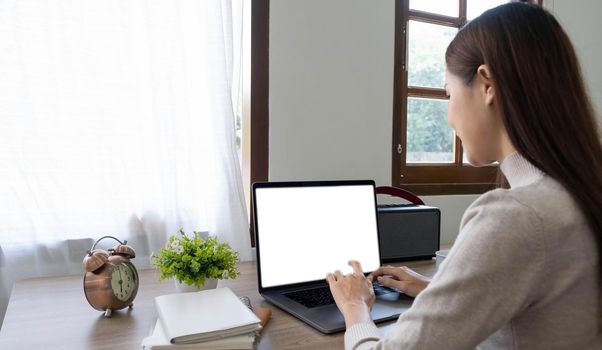 computer screen blank mockup.hand woman work using laptop with white background for advertising,contact business search information on desk at coffee shop.marketing and creative design.