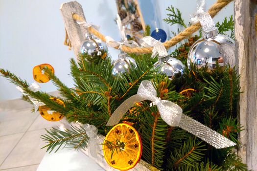 Beautiful decorated Christmas wreath of spruce and dried oranges