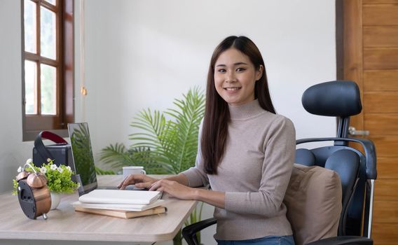 Young woman using computer laptop happy face smiling looking at the camera. Positive person..