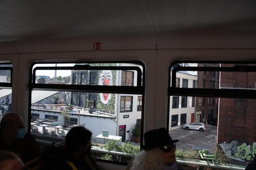 WUPPERTAL, GERMANY - April 11, 2022: Wuppertal Suspension Railway train in Germany. The unique electric monorail system is Wuppertal's landmark. High quality photo