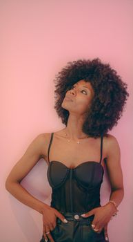 Young attractive African woman with happy cheerful smile having fun in studio