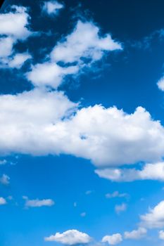 Nature backdrop, solar energy and spiritual concept - Blue sky background, white clouds and bright sunlight