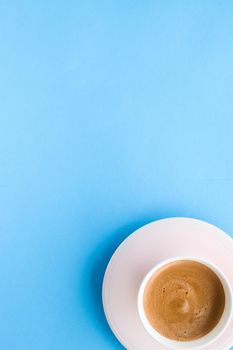 Breakfast, drinks and modern lifestyle concept - Hot aromatic coffee on blue background, flatlay