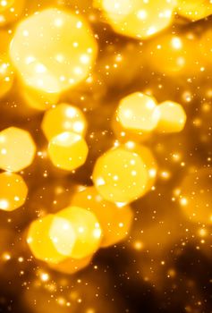 Golden Christmas lights, New Years Eve fireworks and abstract texture concept - Glamorous gold shiny glow and glitter, luxury holiday background