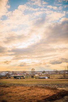 russian village landscape at sunset.