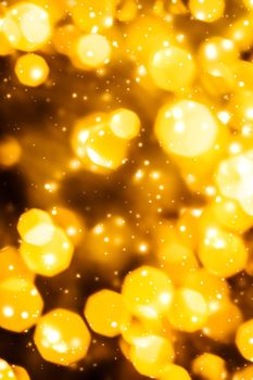 Golden Christmas lights, New Years Eve fireworks and abstract texture concept - Glamorous gold shiny glow and glitter, luxury holiday background