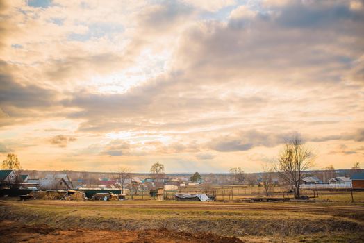 russian village landscape at sunset.