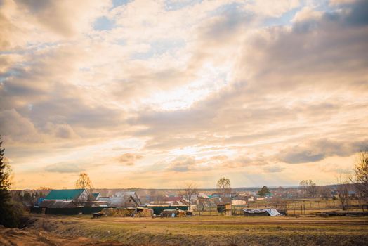 russian village landscape at sunset.