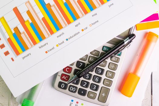 document color graph sheet for presentation at the office with equipment calculator, pen, color pen highlight