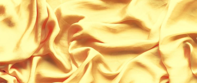 Luxury golden silk background texture - elegant fabric textures, abstract backgrounds and modern pastel colours concept