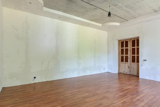 Interior of an empty room with a final renovation under a wallpaper sticker a