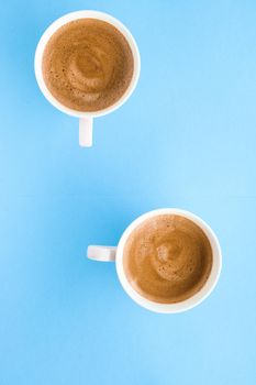 Breakfast, drinks and modern lifestyle concept - Hot aromatic coffee on blue background, flatlay