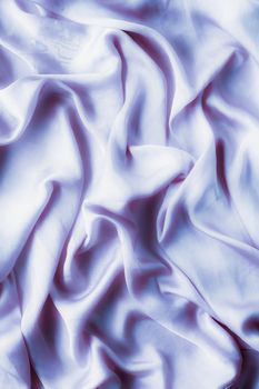 Elegant fabric texture, abstract backdrop and modern pastel colours concept - Purple soft silk waves, flatlay background