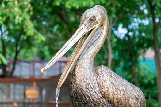 pelican sculpture in the form of a fountain. photo