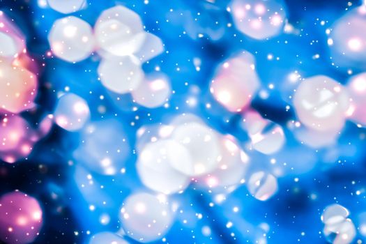 Christmas lights, New Years Eve fireworks and abstract texture concept - Magic sparkling shiny glitter and glowing snow, luxury winter holiday background