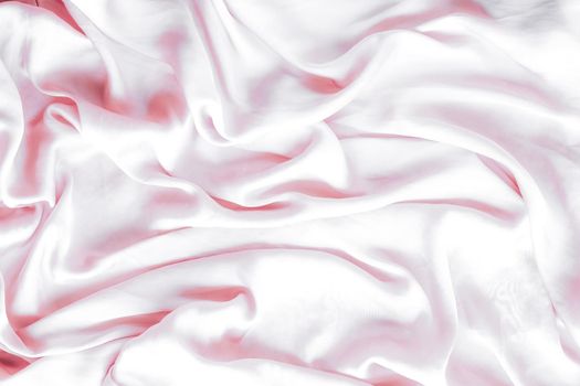 Elegant fabric texture, abstract backdrop and modern pastel colours concept - Pink soft silk waves, flatlay background