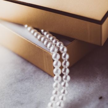 Valentine's day ideas, luxury shopping and holiday inspiration concept - Pearl jewellery in a vintage golden gift box