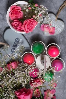 colorful easter eggs scattered on gray concrete background, top view, High quality photo