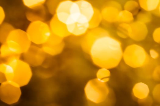 Golden Christmas lights, New Years Eve fireworks and abstract texture concept - Glamorous gold shiny glow and glitter, luxury holiday background