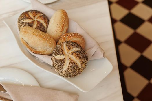 Gluten free pastry, eating out and healthy lifestyle concept - Fresh white bread in a restaurant