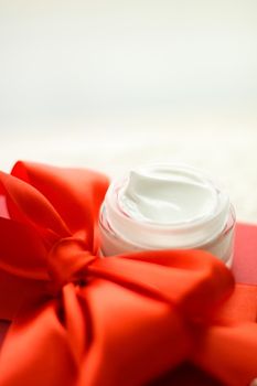 Beauty, cosmetics and skincare styled concept - Luxury face cream jar and red gift box