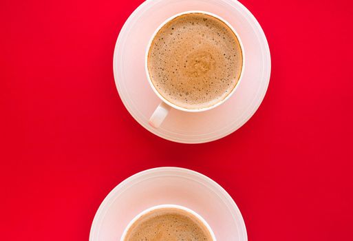 Breakfast, drinks and modern lifestyle concept - Hot aromatic coffee on red background, flatlay