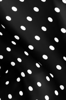 Fashion design, interior decor and classic material concept - Vintage polka dot textile background texture, white dots on black luxury fabric design pattern