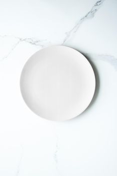 White empty plate on marble, flatlay - stylish tableware, romantic table decor and food menu concept. Serve the perfect dish