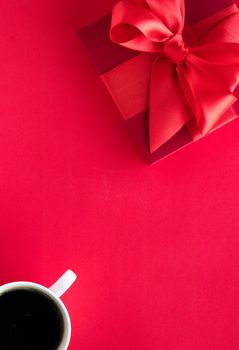 Romantic celebration, lifestyle and birthday present concept - Luxury beauty gift box and coffee on red, flatlay